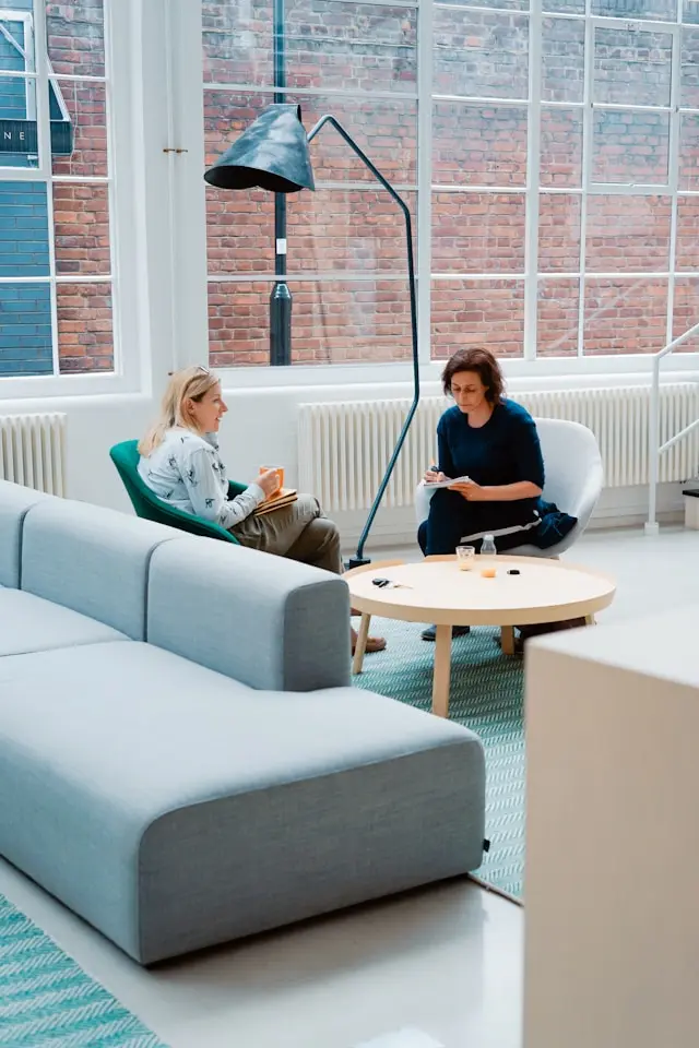 Two people sitting together and having a conversation